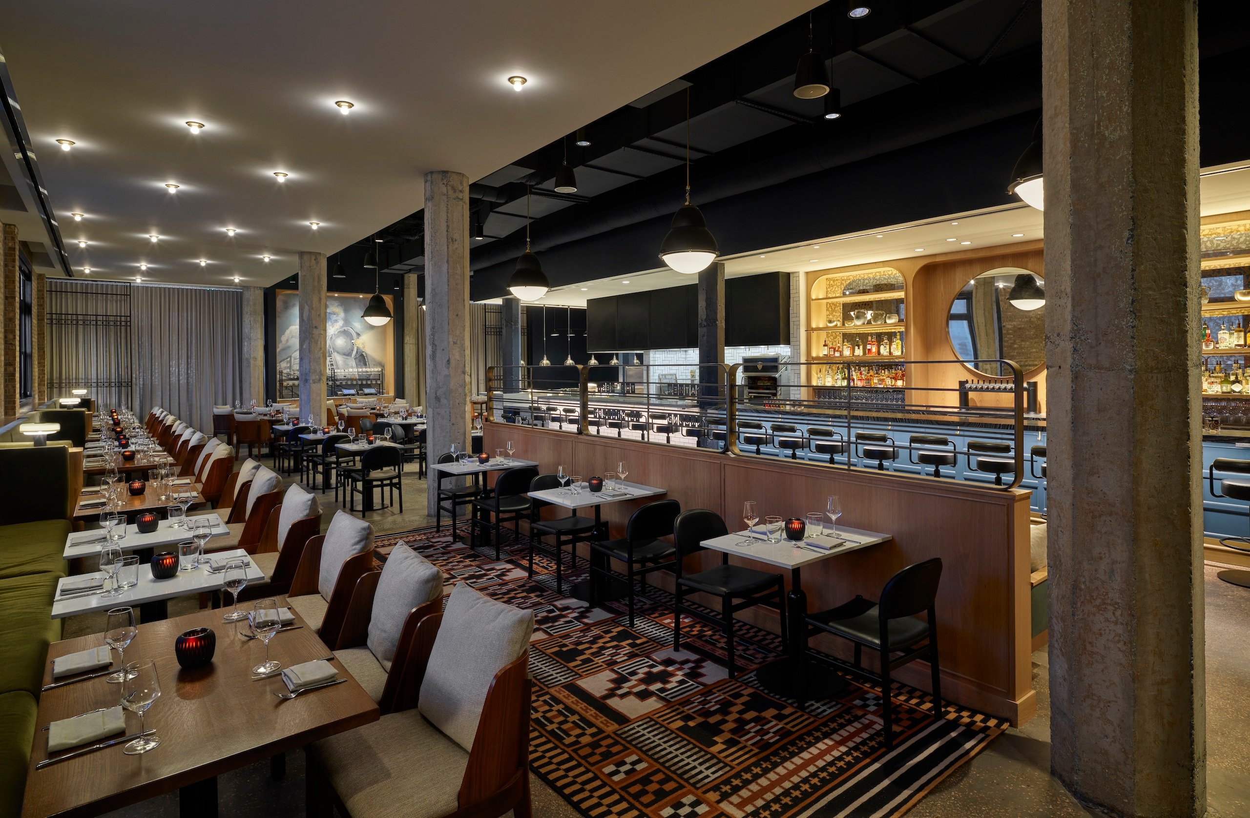 Rows of set dining tables inside Rouser restaurant at Asher Adams Hotel, Salt Lake City
