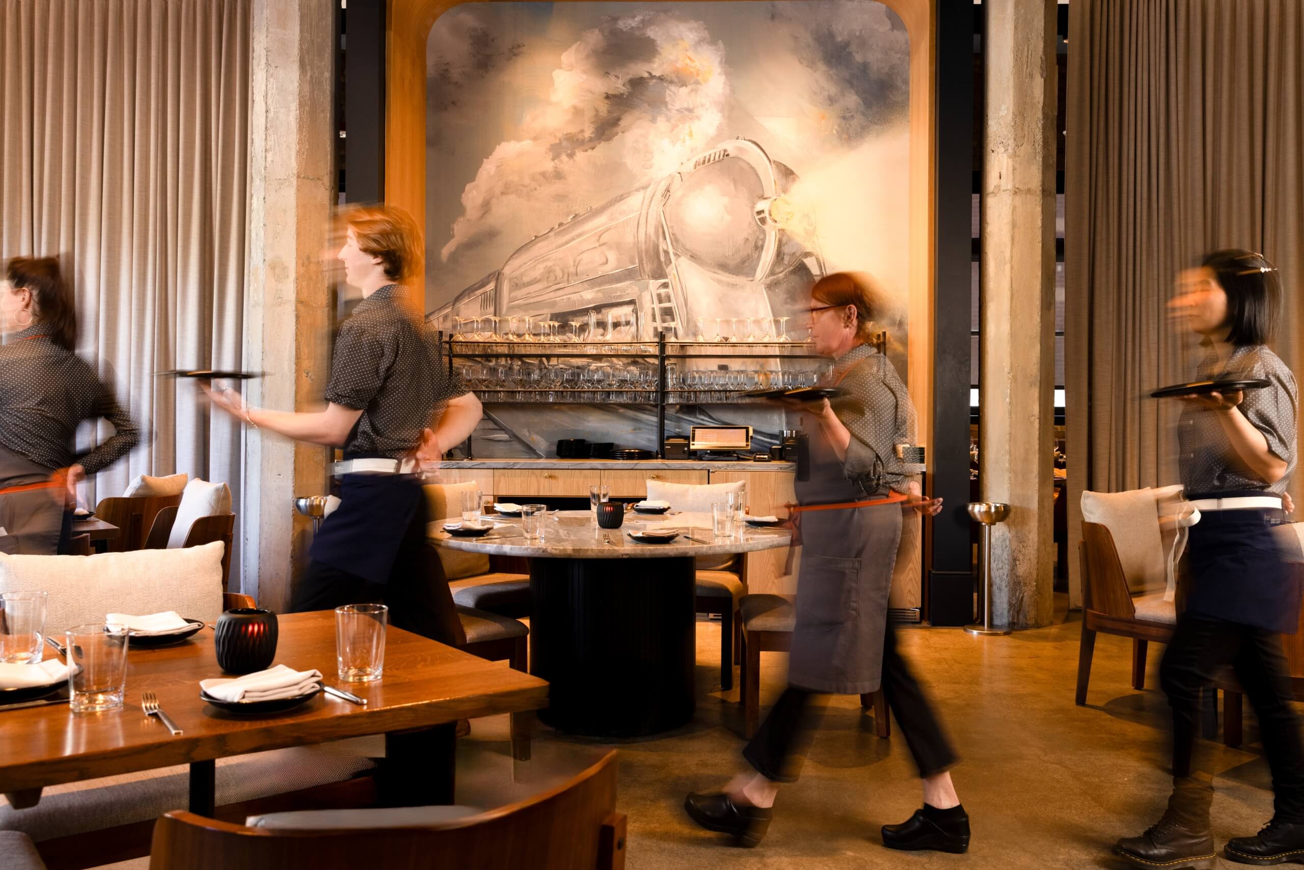Employees serving food professionally at Rouser