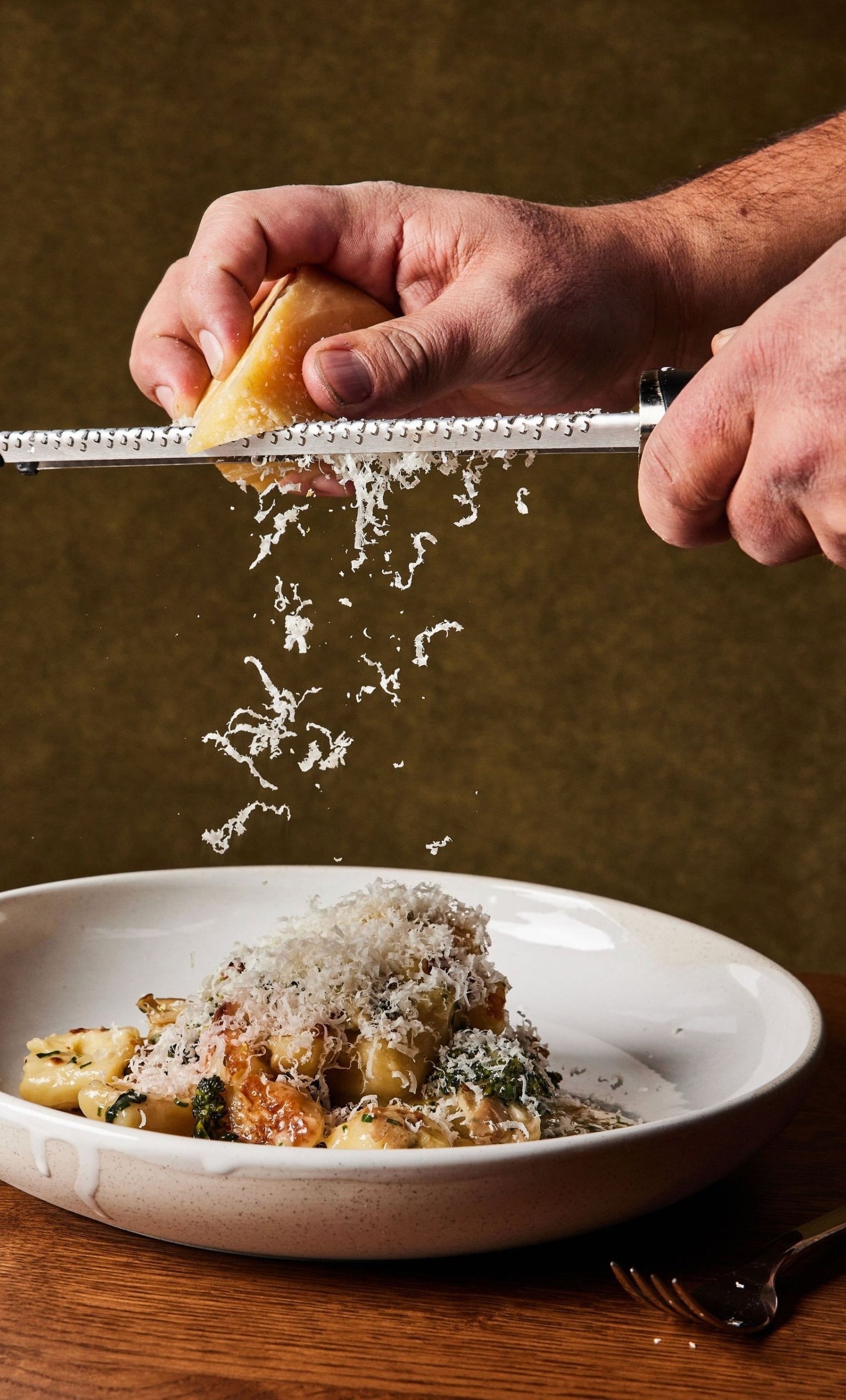 A pasta dish smothered in grated parmesan cheese served at Rouser, restaurant at Asher Adams Hotel, Salt Lake City