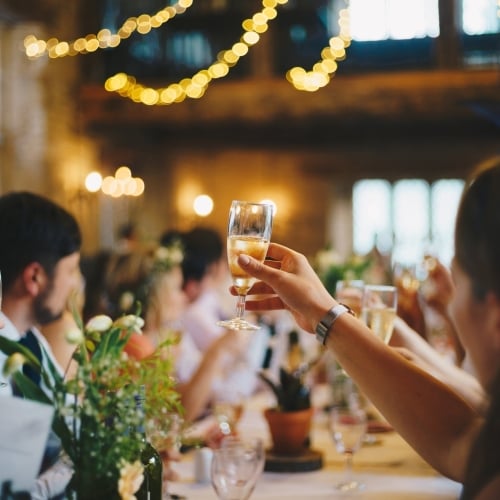 Event guests raise champagne flutes to cheers at Asher Adams Hotel, Salt Lake City