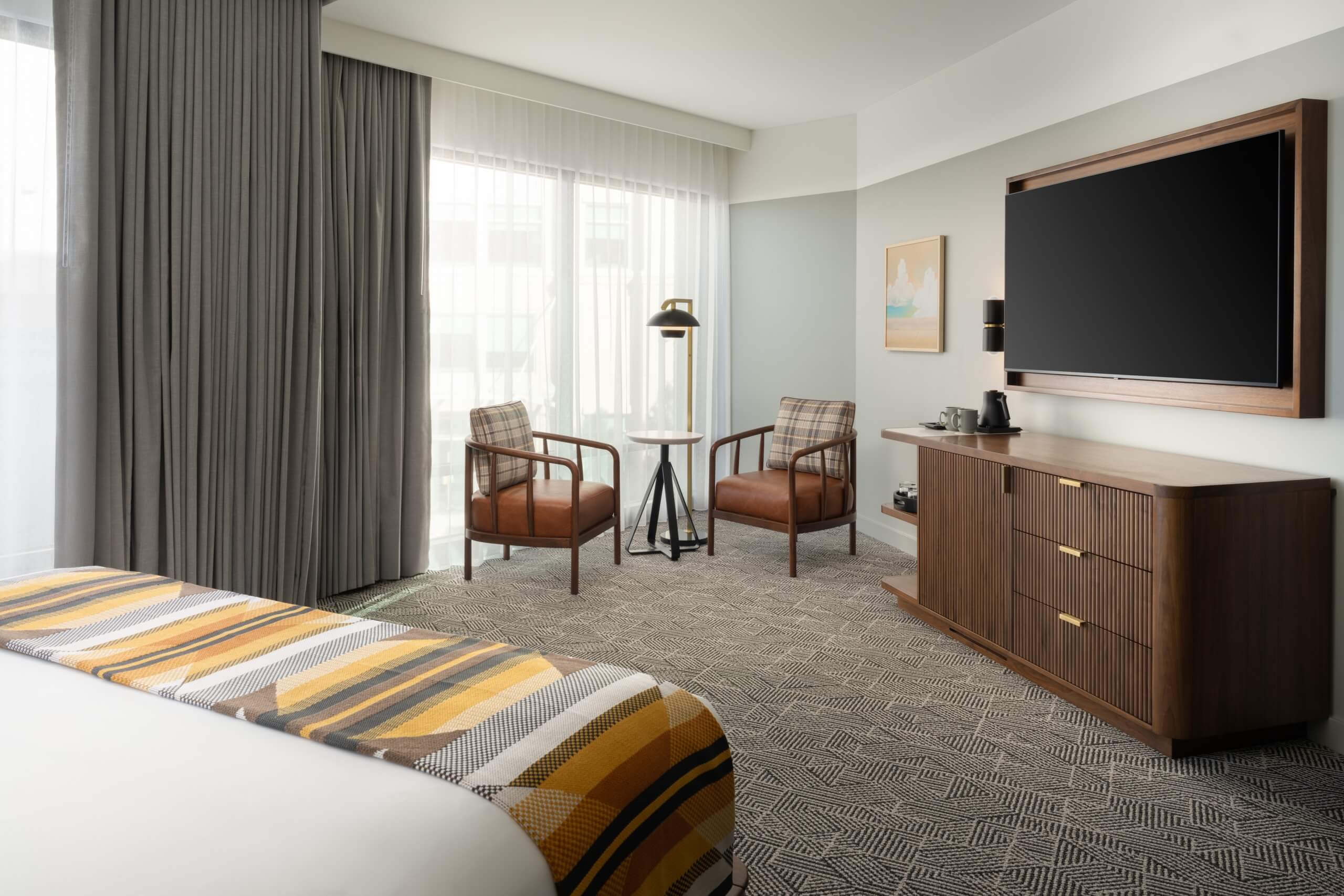 The wall-mounted TV in a suite at Asher Adams Hotel in Salt Lake City